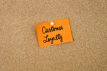 Customer Loyalty written on orange paper note