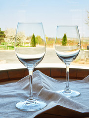 Empty wine glasses on wooden barrel