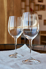 Empty wine glasses on wooden barrel
