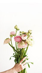 Woman hands holding a flower bouquet