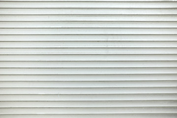 Obraz premium Closed white steel rolling door.