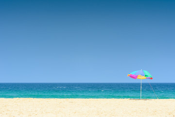 Colorful umbrella on a beautiful tropical beach