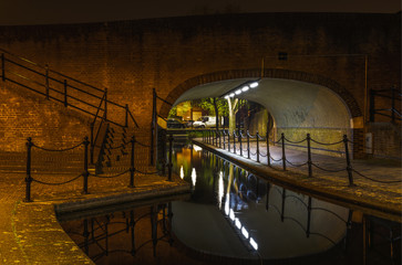 Albion Channel under a path bridge, an ornamental canal created linking Canada Water to Surrey Water