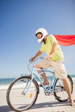 Senior superhero riding bike © WavebreakMediaMicro