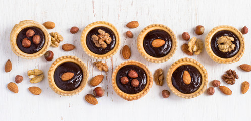 Shape Line small Tarts with chocolate and different nuts White b