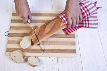slicing french baguette bread