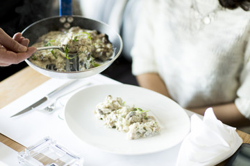 Woman at the table in the restaurant