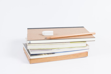 Books stack with pencil and rubber