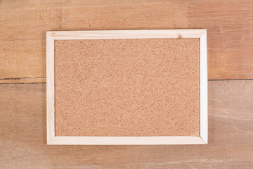 Fototapeta premium The cork board on the plank wood