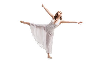 Young woman dancing in dress over white