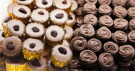 Luxury chocolate candies lay on a counter