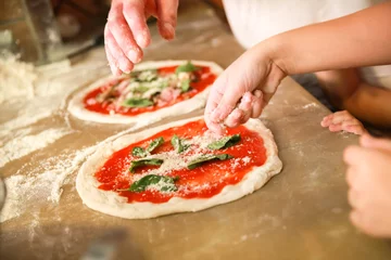 Poster Preparing Pizza Margherita. Cooks hands © evannovostro