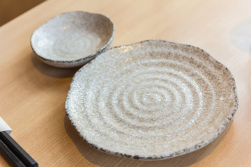 empty spiral pattern plate on wood table