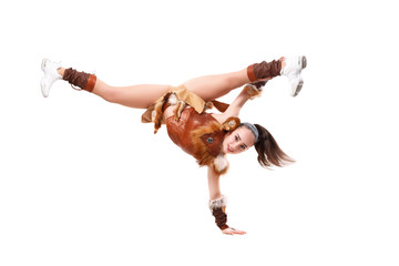 Young professional cheerleader dressed in a warrior costume standing on one hand. Horizontal splits
