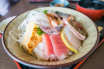 Japanese raw fish selection cut and presented on a long plate