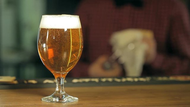 A glass of beer on the table