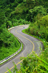 Fototapeta na wymiar curved Road in forest , Thailand. 
