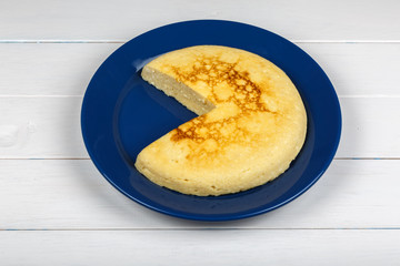 Backed pot cheese pie on white wooden background.