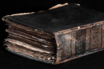yellowed old thick book on the table