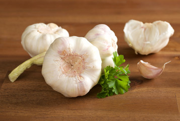 garlic bulb and clove on wooden background