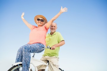 Senior couple going for a bike ride