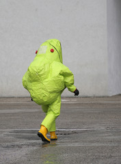 man with yellow protective gear against biological risk