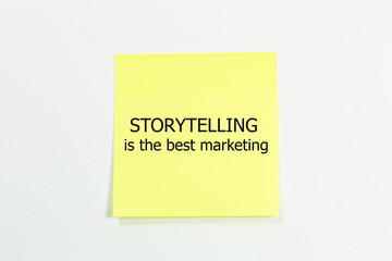 Storytelling is the best Marketing word written on yellow sticky notes. isolated on white