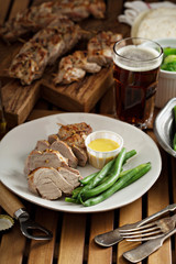 Grilled braided pork with green beans 