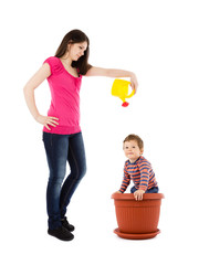 mother watering baby plant