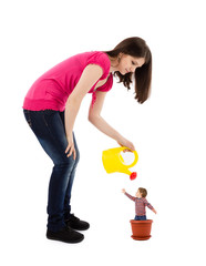 mother watering baby plant