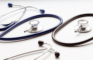 two disassembled stethoscope in white background