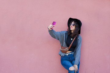 girl becoming a selfie with mobile
