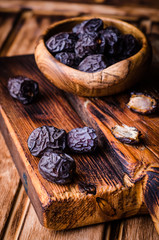 Fresh dried  Dates fruits  on vintage wooden background. Selective focus. Toned image