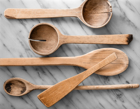 Spoons Laying On A Marble Countertop, View From Above