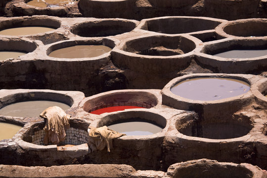Morocco. Fez (Fes el-Bali). The tanner's quarter - close up of tubs (bend) with dyes in them