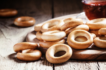 Bagels and tea, vintage wooden background, selective focus