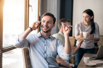Pleasant man talking on cell hone 
