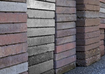 CLOSE UP IMAGE OF STACKED CONCRETE TILES
