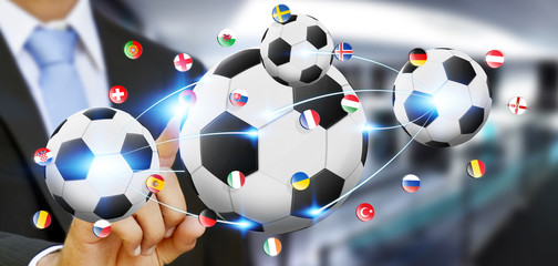 Businessman holding football in his hand