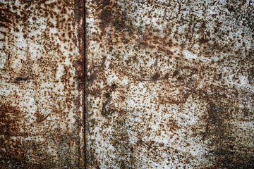 Rust on a metal surface with falling-off paint