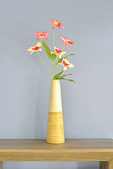Vintage Flower Vase on the table against grey wall