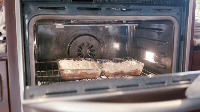Pulling Baked Yums WIth Marshmellows Out of the Oven