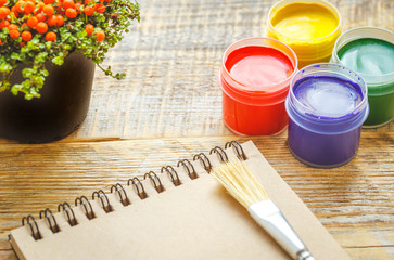 hobby painting - workplace with colored pencils, gouache jars