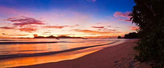 Fotobehang Tropisch strand Tropical island at sunset