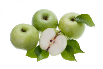 top view of green apples on white.