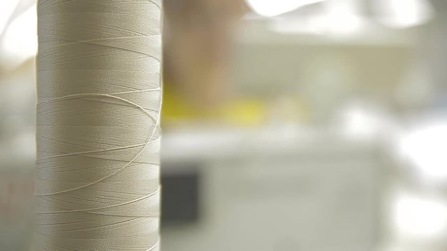 A skein of thread on a sewing machine.