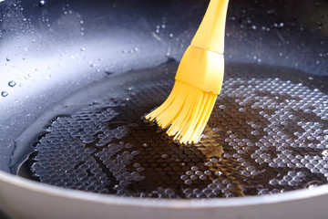 Greasing pan by silicone brush