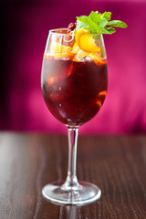 wine cocktail with mint garnish.