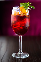 wine cocktail with mint garnish.