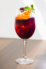 wine cocktail with mint garnish.